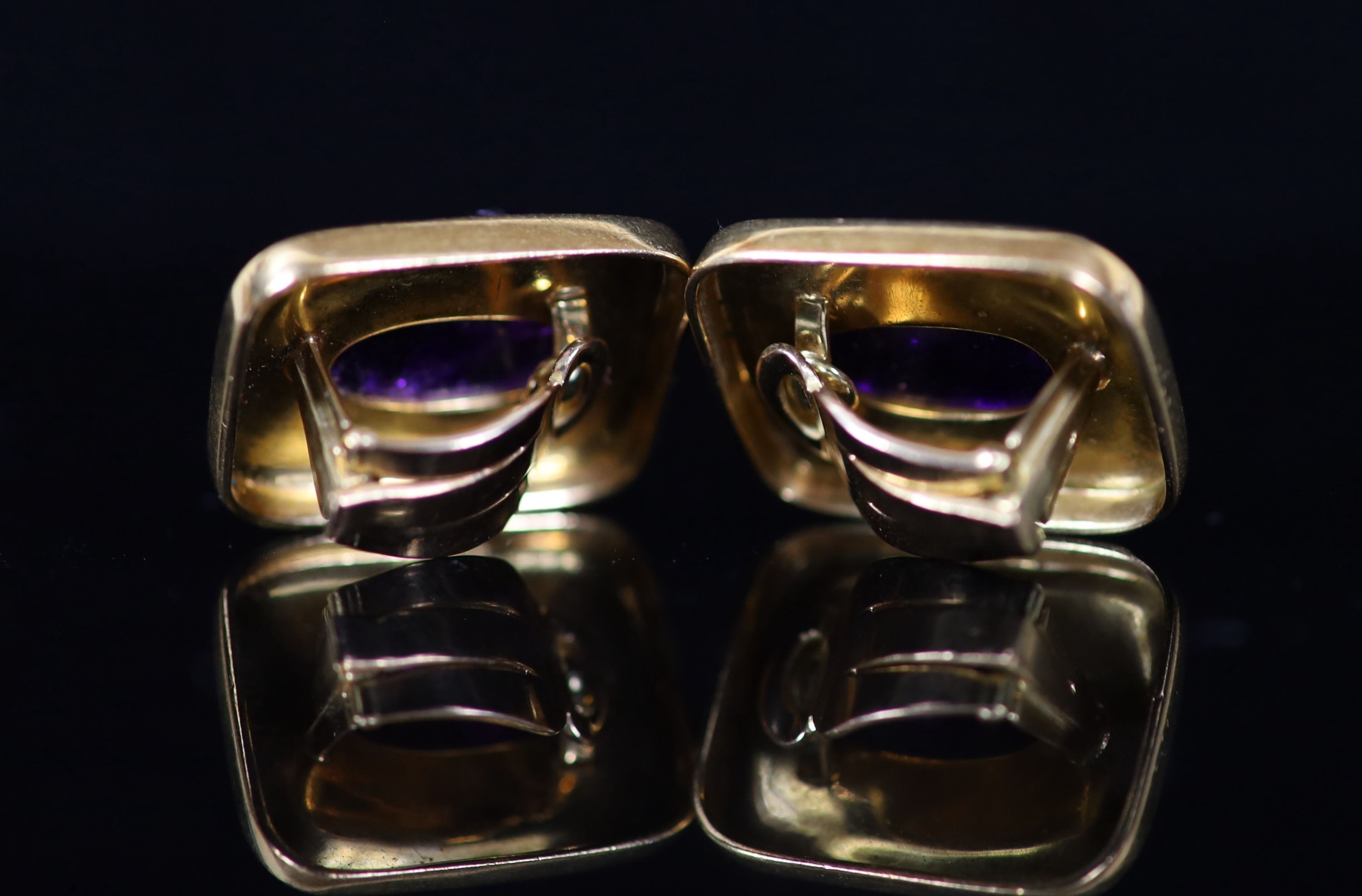 A pair of 1970's Brazilian textured 750 gold and cabochon amethyst Forma Livre set rectangular ear clips, by Haroldo Burle-Marx